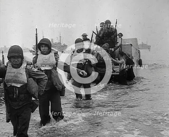 American Troops Walking Onto a North African Beach as Part of 'Operation Torch’, 1942. Creator: British Pathe Ltd.