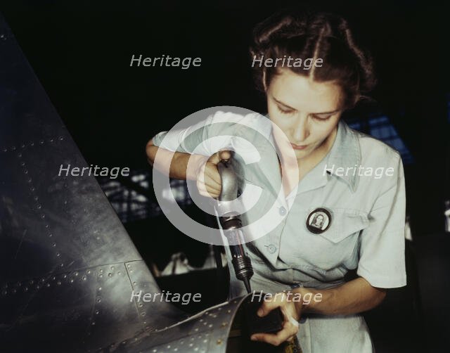 Answering the nation's need for womanpower, Mrs. Virginia Davis made arrangement for the.., 1942. Creator: Howard Hollem.