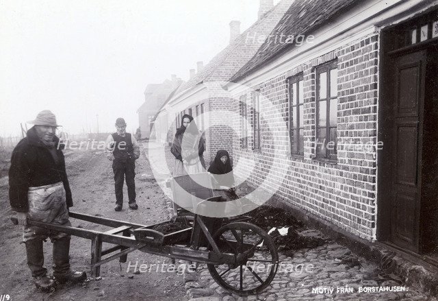 Fisherman with his wheelbarrow, Borstahusen, Landskrona, Sweden, c1900. Artist: Unknown
