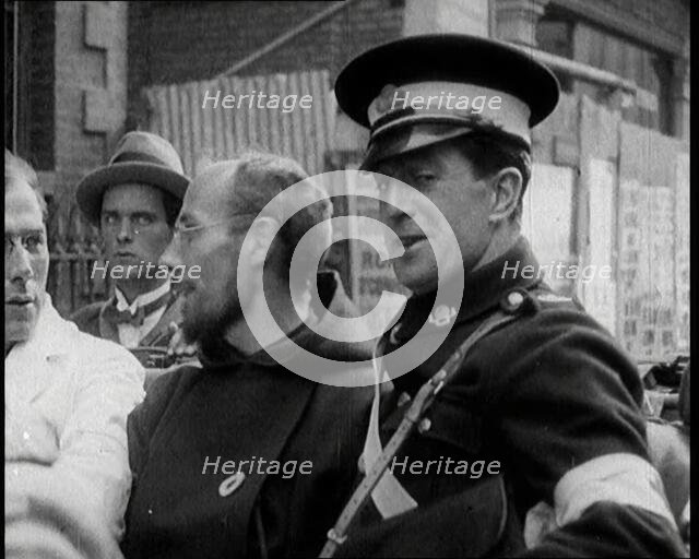 An Irish Priest Talking to a Soldier in a Car, Trying to Bring Peace, 1922. Creator: British Pathe Ltd.