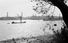 A Thames sailing barge on the River Thames at Tilbury, Essex, c1945-c1965.  Artist: SW Rawlings
