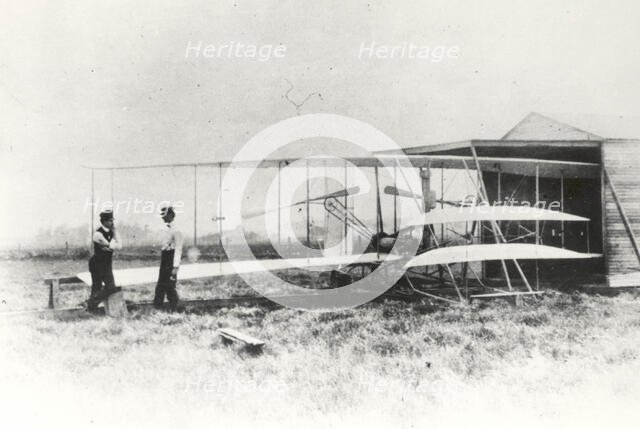 Wilbur and Orville Wright with Flyer II at Huffman Prairie, Dayton, Ohio, USA, May 1, 1904.  Creator: NASA.