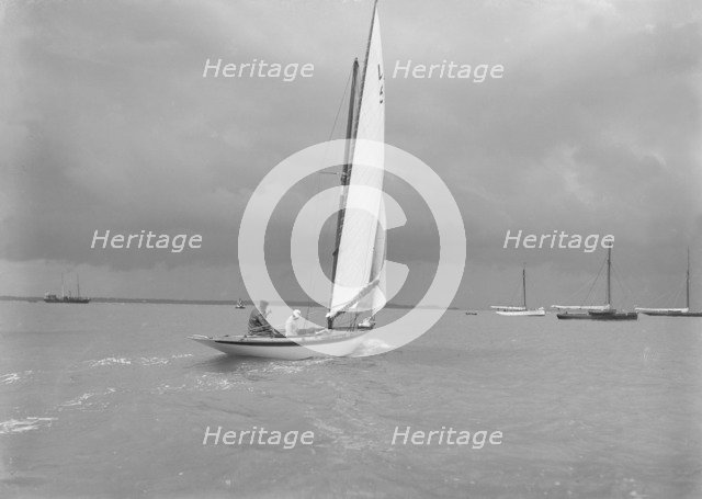 6 Metre Class 'Jonquil' (L5) with Captain R J Dixon at the helm. Creator: Kirk & Sons of Cowes.