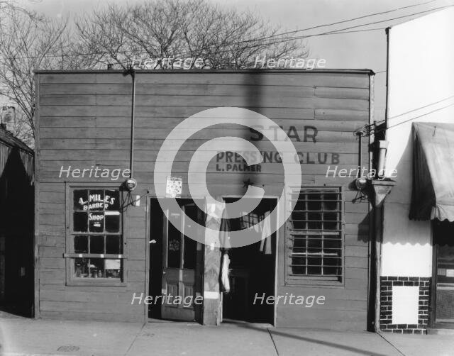 Negro shop, Shop fronts, laundry and barber shop, Vicksburg, Mississippi, 1936. Creator: Walker Evans.