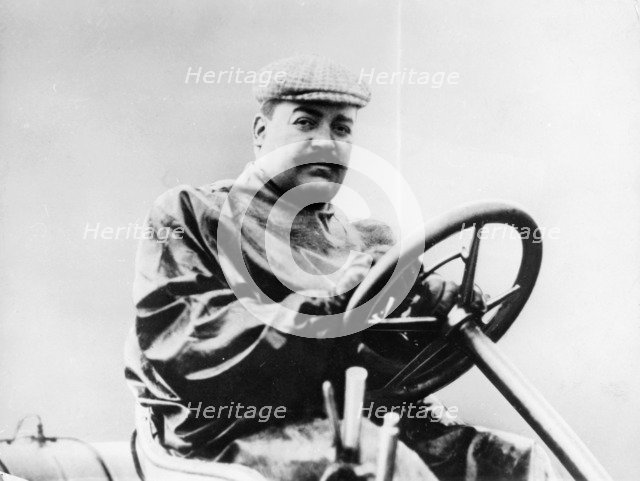 Vincenzo Lancia at the wheel of a car. Artist: Unknown