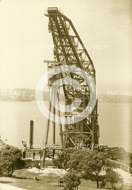 Erection of H.M.A.S. Sydney's mast, Bradleys Head, 1934. Creator: Unknown.