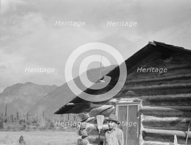 The mother, father, and hardworking fifteen-year-old son in yard..., Boundary County, Idaho, 1939. Creator: Dorothea Lange.