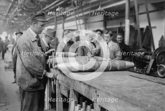 Removing nose from 6 inch shell, between c1915 and c1920. Creator: Bain News Service.
