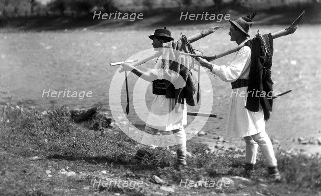 Foresters carrying their tools, Bistrita Valley, Moldavia, north-east Romania, c1920-c1945. Artist: Adolph Chevalier
