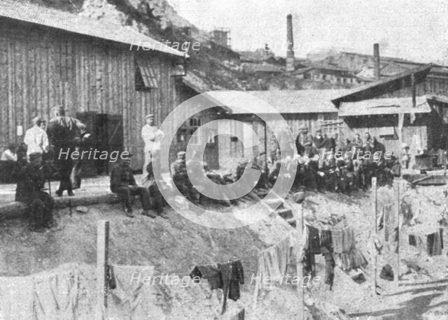 'Marseille en Fete; Prisonniers allemands au repos devant leurs baraquements a l'Estaque', 1916. Creator: Unknown.
