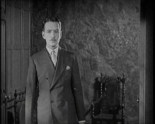 An Extract from a Silent Film. A Male Actor Enters Through a Door, 1920s. Creator: British Pathe Ltd.