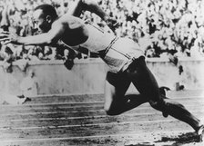 Jesse Owens, American athlete, competing in the Olympics in Berlin, Germany, 1936. Artist: Unknown