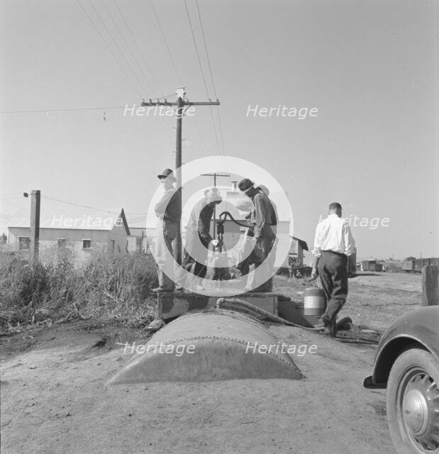Town pump of Tulelake at railroad yard, Tulelake, Siskiyou County, California, 1939. Creator: Dorothea Lange.