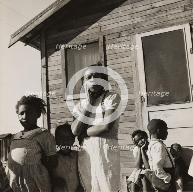 Colored family from near Houston, Texas. Been in California for two years. Husband came..., 1939. Creators: Farm Security Administration, Dorothea Lange.