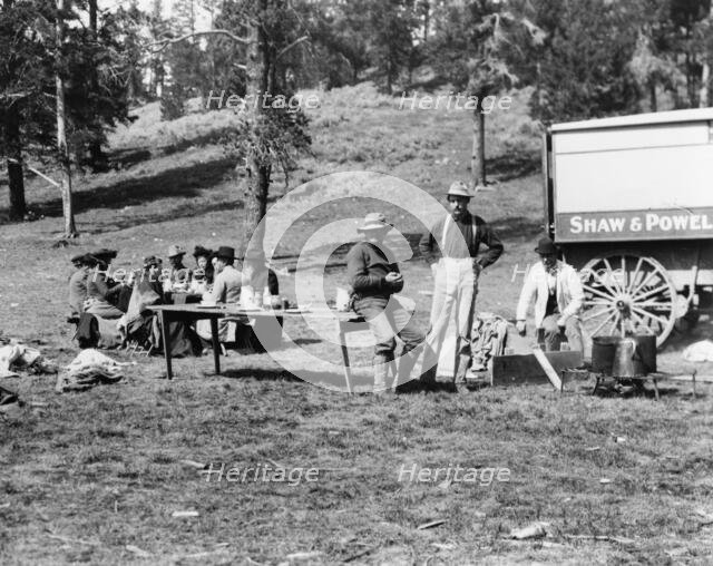 Tourists and guides picnicking in Yellowstone Park, 1903. Creator: Frances Benjamin Johnston.