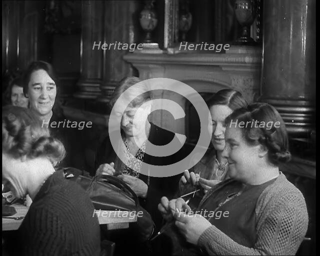 Buckingham Palace Hosting a Sewing Group. Large Numbers of Women Sewing or Knitting, 1940. Creator: British Pathe Ltd.