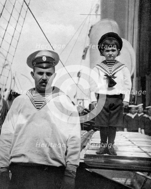 The little Caesarevitch with his sailor friend, 1908.Artist: Queen Alexandra