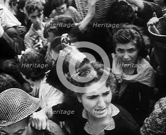 Italian Civilians Gathering Water in Naples, 1943-1944. Creator: British Pathe Ltd.