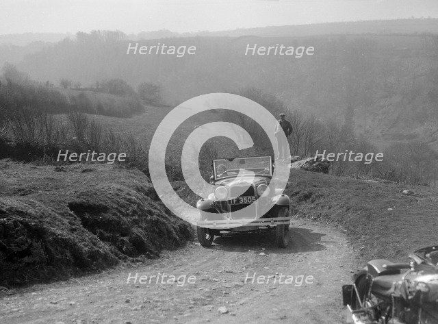 Kitty Brunell driving a 1930 2-seater Ford Model A, 1931.   Artist: Bill Brunell.