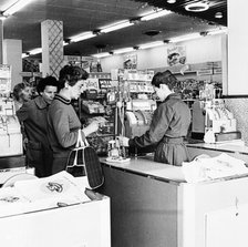 Shoppers at a checkout in a London supermarket, c1950s. Artist: Henry Grant