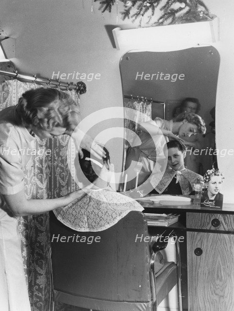 A woman at the hairdresser's, Sweden. Artist: Unknown