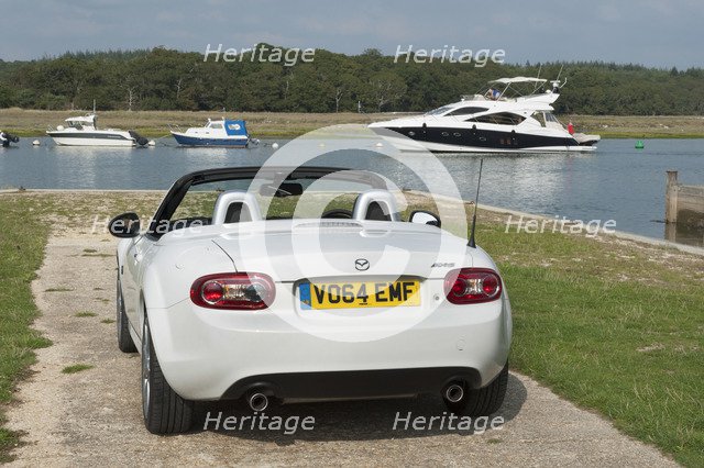 2014 Mazda MX5 Roadster Coupe Artist: Unknown.