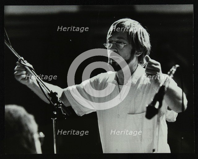 Michael Garrick conducting an orchestra at Berkhamsted Civic Centre, 1985. Artist: Denis Williams