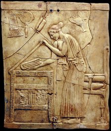 Relief pinax from Locri depicting a woman placing laundry in a laundry chest, Mid of the 5th cen. BC Creator: Classical Antiquities.