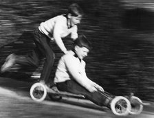 Boys playing with a home-made go-kart, Horley, Surrey, 1965.