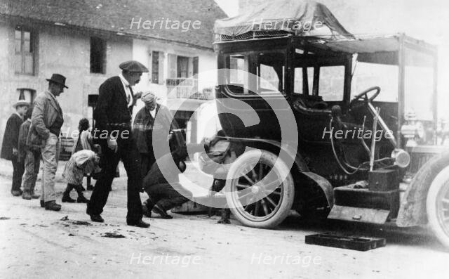 Examination of luggage on automobile, by Customs(?), France, 1905. Creator: Frances Benjamin Johnston.