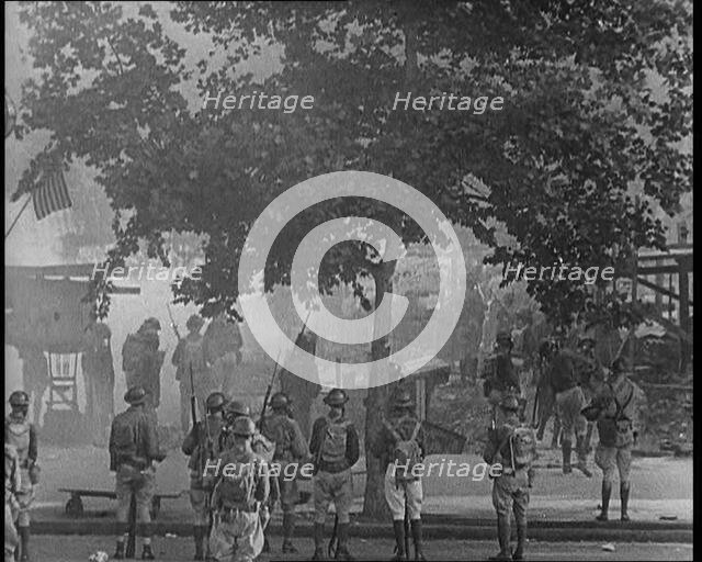U.S Army Soldiers Confronting Protesting Soldiers With Tear Gas and Bayonets To Disperse..., 1932. Creator: British Pathe Ltd.