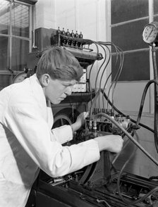 Apprentice at work, Globe & Simpson auto electrical workshop, Nottingham, Nottinghamshire, 1961. Artist: Michael Walters