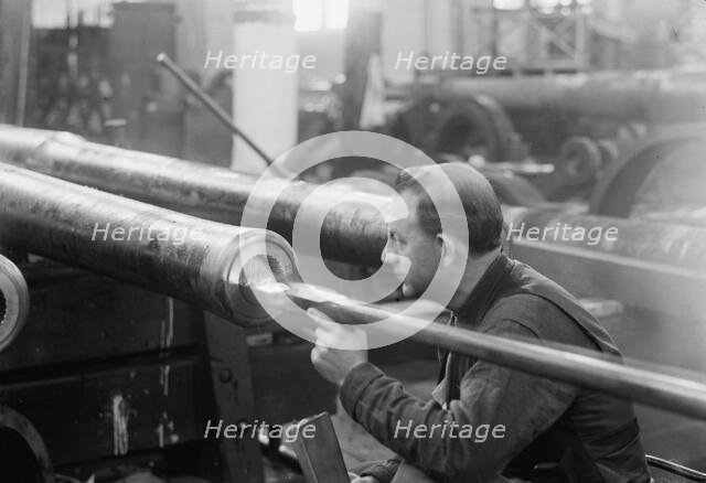 Navy Yard, U.S., Washington - Turning, Examining And Boring A 5 Inch, 50 Cal. Gun, 1917. Creator: Harris & Ewing.