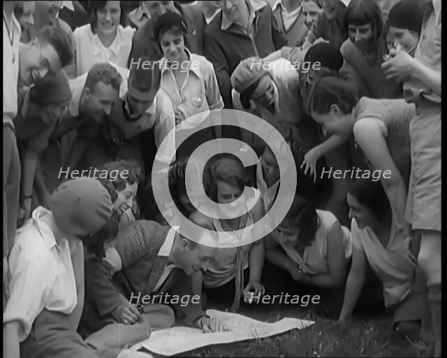 A Large Group of Hikers Setting Off for a Walk in the Countryside, 1931. Creator: British Pathe Ltd.