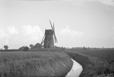 View from the north looking towards Sneath's Mill, Lutton Gowts, Lutton, Lincolnshire, 1936.  Creator: HES Simmons.