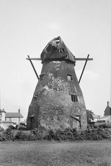 Exterior view of the derelict tower mill on Mill Green, Warboys, Cambridgeshire, 1936. Creator: HES Simmons.