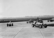 Racing cars taking a corner at Brooklands, Surrey, c1930s. Artist: Bill Brunell.