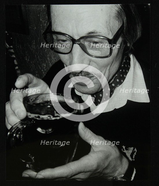 Tom Burnham with a pint at The Bell, Codicote, Hertfordshire, December 1986. Artist: Denis Williams