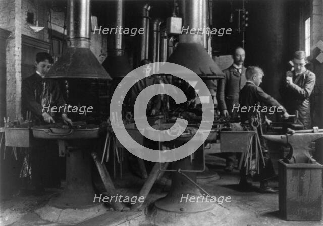 Metal shop (blacksmithing) class in a Washington, D.C., high school, (1899?). Creator: Frances Benjamin Johnston.