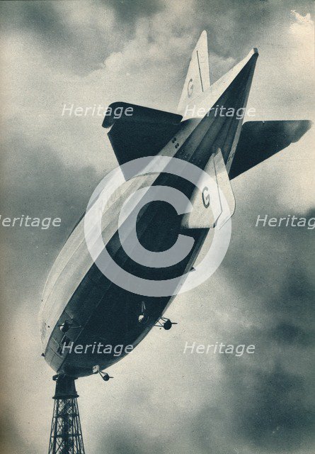 British rigid airship R101 riding at her mooring mast at Cardington, Bedfordshire, c1929 (c1937). Artist: Unknown.