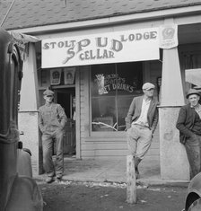 On main street of potato town during harvest season, Merrill, Oregon, 1939. Creator: Dorothea Lange.