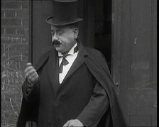 Theatre Star Billy Bennett Walking Out of a Doorway..., 1920s Creator: British Pathe Ltd.