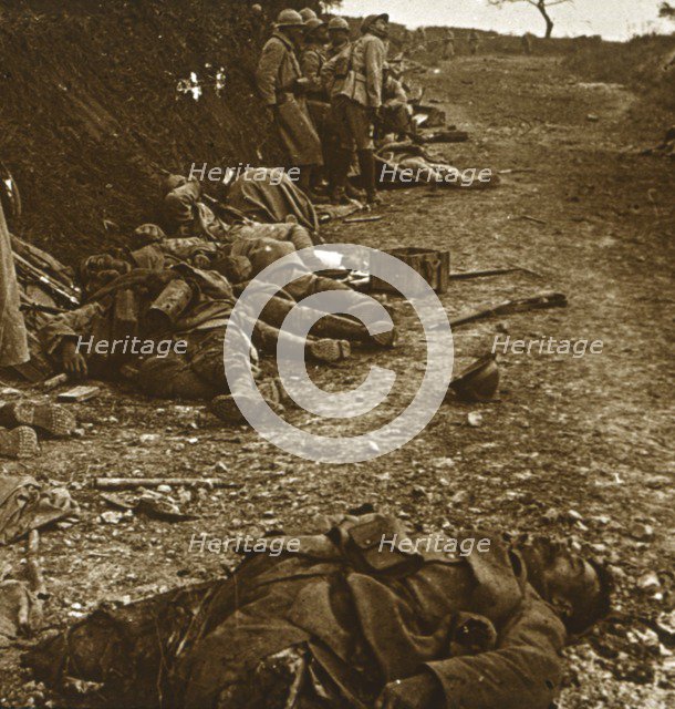 Bodies after the taking of Courcelles, northern France, 1918. Artist: Unknown.