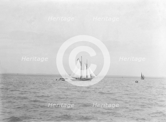 The 21-ton schooner 'Diablesse' leaving Cowes for America, 1922.  Creator: Kirk & Sons of Cowes.