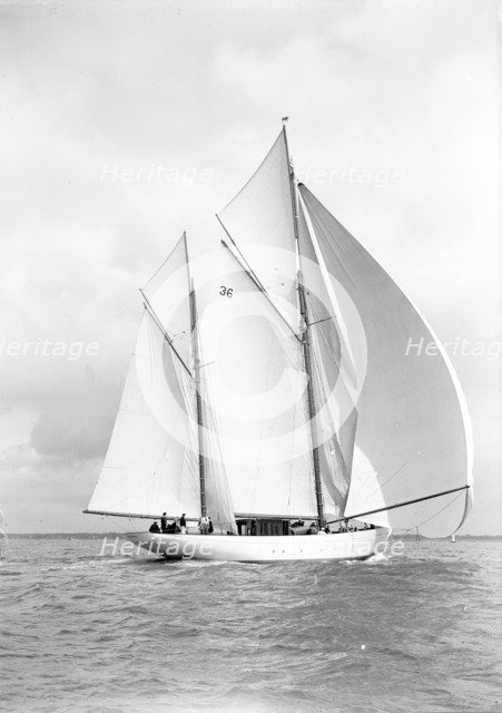 The 105 ft ketch 'Thendara' sailing with spinnaker. 1939. Creator: Kirk & Sons of Cowes.