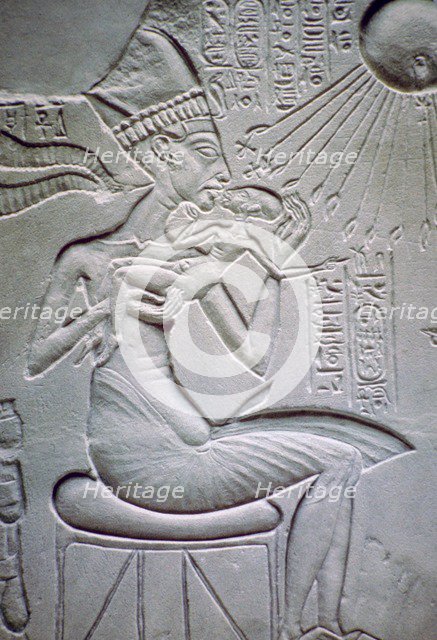 Akhenaten holding one of his daughters. Artist: Unknown