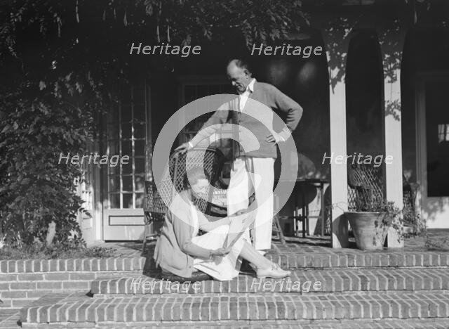Mr. and Mrs. Hamilton King seated on the steps of their house, between 1911 and 1934. Creator: Arnold Genthe.