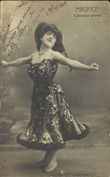 An actor in drag, known as "Maurice"; poses on stage mid-dance, 1908. Creator: Unknown.