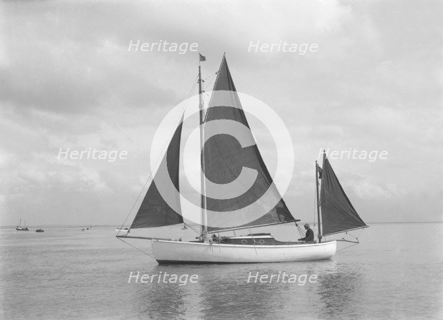 The 4 ton yawl 'Mandy' under sail, 1922. Creator: Kirk & Sons of Cowes.