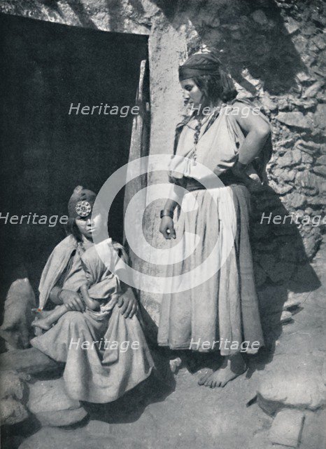 Kabyle women at the door of their dwelling near the Mediterranean coast, Algeria, 1912.. Artist: Kuhn.
